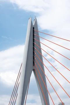 Tall angular cable?stayed bridge pylon with radiating red stay cables Stock Photos