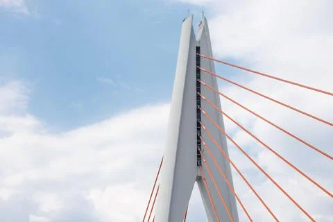 Tall angular cable?stayed bridge pylon with radiating red stay cables Stock Photos