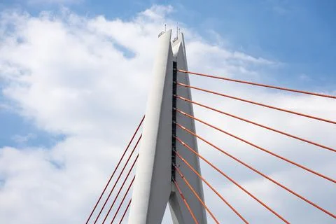 Tall angular cable?stayed bridge pylon with radiating red stay cables Stock Photos