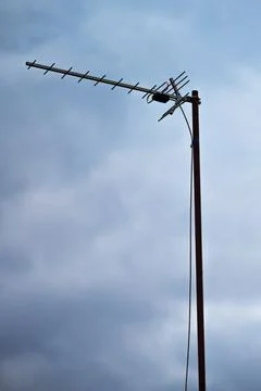 Tall Antenna Against Dramatic Cloudy Sky Stock Photos