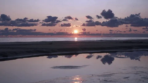 Tall backpacker watch clear sunny spring daybreak over sea. Stock Footage 126570827