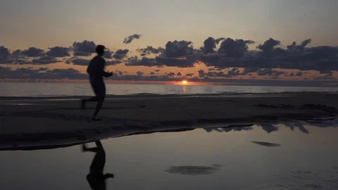 Tall backpacker watch clear sunny spring daybreak over sea. Stock Footage 126574701