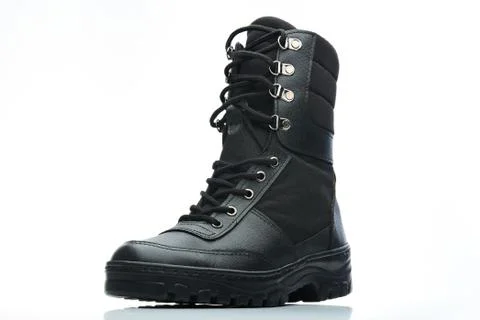 Tall black combat boot Stock Photos