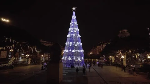 Tall blue and white illuminated Christmas tree in the city center. Stock Footage 327624692