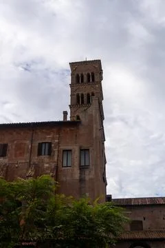 A tall brick building with a clock tower Stock Photos