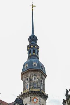 A tall building with a clock on the front in Dresden Saxony Germany Stock Photos