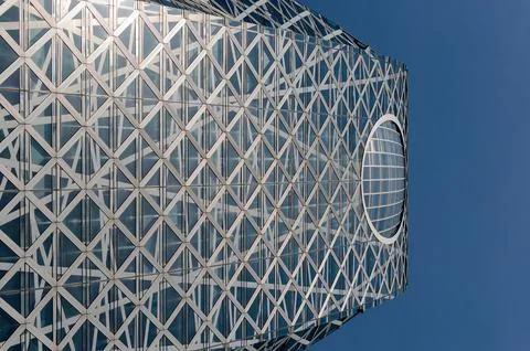 A tall building with a large circular window on the top 스톡 사진