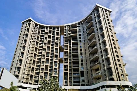 Tall building project under construction on a background of blue sky in Pune, Stock Photos