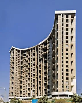 Tall building project , under construction on a background of blue sky. Stock Photos