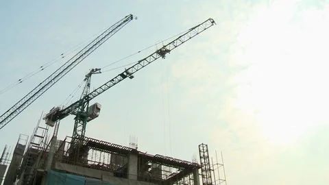 A tall building under construction against the sky Stock Footage 120033974
