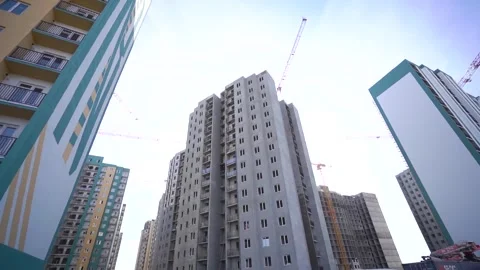 Tall building under construction, cranes around Stock Footage 255199084
