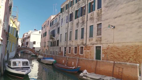 The tall buildings on the side of the canal in Venice Italy Stock Footage 82812612