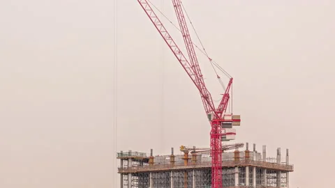 Tall buildings under construction and cranes timelapse Stock Footage 197106469