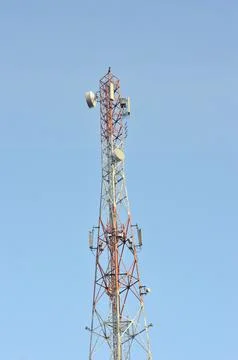 Tall cell tower reaching sky for modern connection Stock Photos