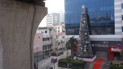 A tall Christmas tree in front of building in Hyderabad,India Stock Footage 83459407