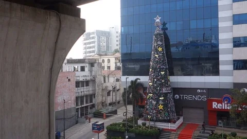 A tall Christmas tree in front of building in Hyderabad,India Stock Footage 83459487