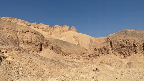 Tall cliffs and desert mountains surrounding the Valley of the Kings in Luxor Stock Footage 317578260