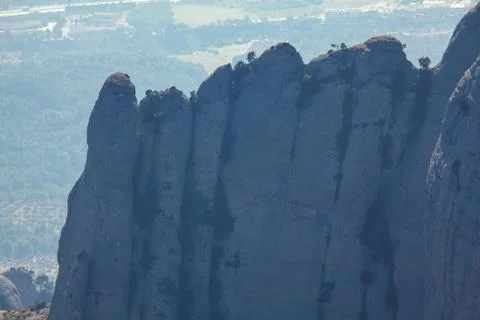 Tall cliffs of Montserrat Stock Photos