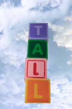 Tall in clouds assorted toy play blocks Stock Photos