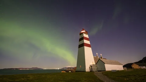Tall lighthouse tower with Aurora Borealis Stock Footage 250763123