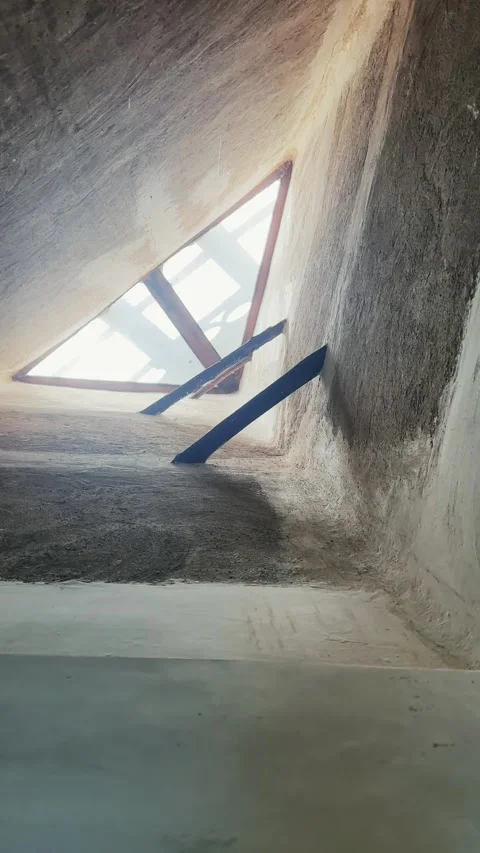 Tall, minimally designed ceiling featuring a triangular-shaped skylight windo Stock Footage 328185795