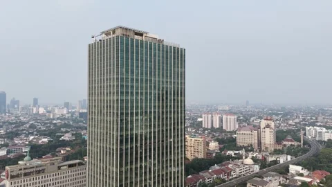 Tall Modern Office Building over Densely Populated City Vídeos de archivo 340633722