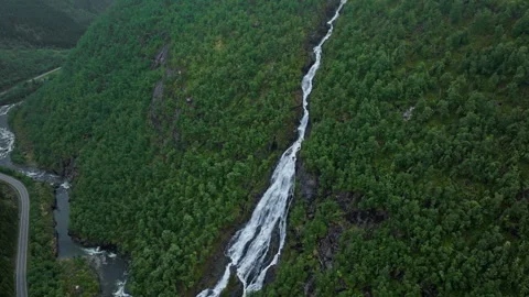 Tall mountain waterfall cascading down valley at Flesefossen, Brattlandsdalen. Stock Footage 328132593