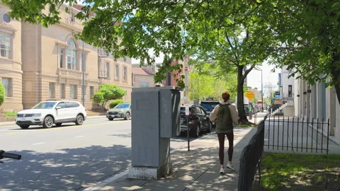 Tall mural of postman playing saxophone Stock Footage 323960494