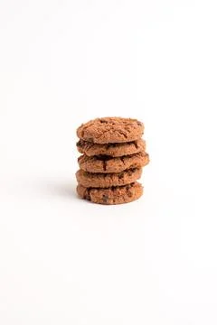 Tall neat stack of crunchy chocolate chip cookies isolated on a white backg.. Stock Photos