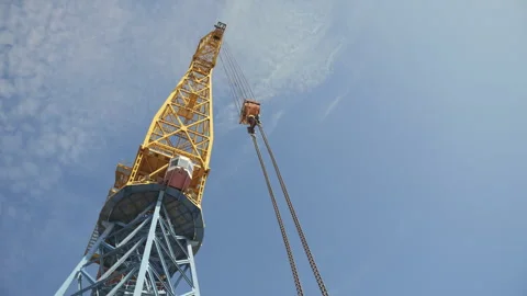 Tall port crane with empty lifting hook Stock Footage 310748804