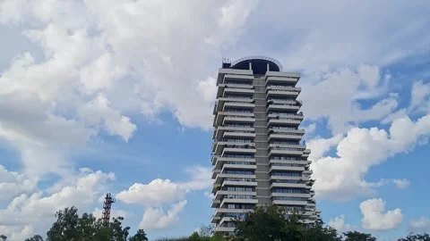 A tall Residential Tower or skyscraper Standing against cloudy sky in banga.. Stock Footage 335648698