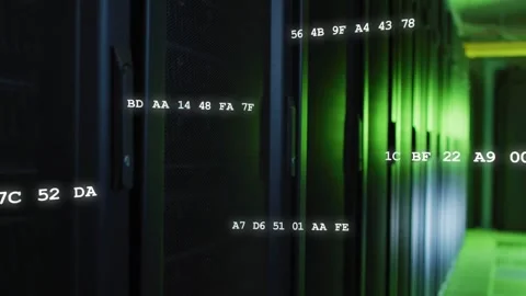 Tall server cabinets lining aisle, camera moving forward while hex codes rising, Stock Footage 331271909