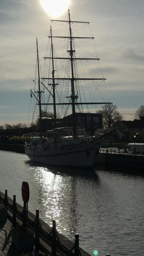 Tall Ship in Klaipeda Harbor With Sun Reflection Stock Footage 336560029