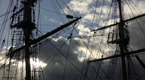 Tall ship masts rigging silhoutte against draatic sky moving clouds Stock Footage 60005237