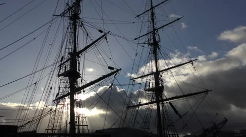 Tall Ship rigging silhouetted dramatic sky movement Stock Footage 60005200