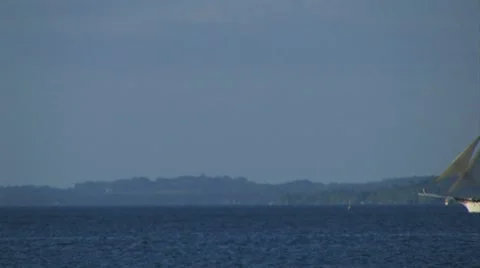 Tall ship sails across frame Stock Footage 7762874