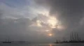 Tall ships leaving harbor with dark sunset clouds HD Footage