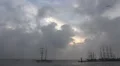 Tall ships leaving harbor with rising clouds and seagull HD Footage