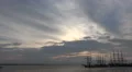 Tall ships leaving harbor timelapse cloudy sunset time HD Footage