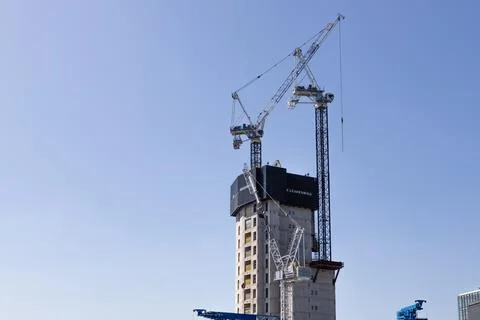 Tall skyscraper under construction with tower cranes. London, UK, 26 May 2023 스톡 사진