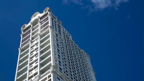 Tall skyscraper under deep blue sky Stock Photos