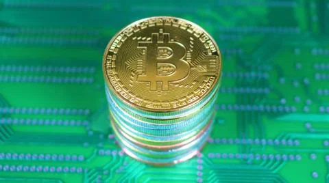 Tall Stack Of Bitcoins On Printed Circuit Board v1 库存照片