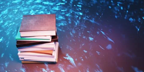 Tall stack of books on shiny surface with abstract blue light Photos