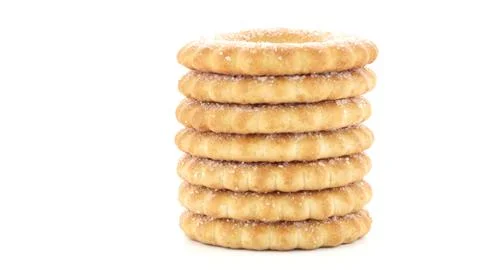 Tall Stack of Sugar Coated Ring Biscuits Isolated on White Background 스톡 사진