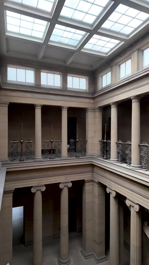 Tall stone columns and upper galleries rise around the interior courtyard of Stock Footage 339926479