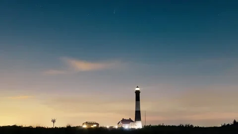 A tall stone lighthouse at night. Fire Island, New York Stock Footage 135834617