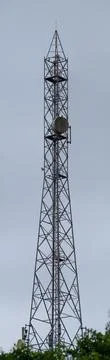 Tall telecommunications tower with cellular network antennas Stock Photos