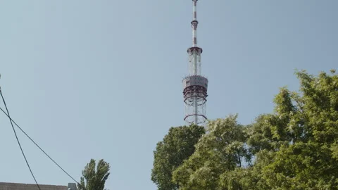 A tall television tower in the city Stock Footage 261407935