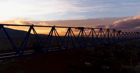 Tall tower Crane Silhouette on construction site at sunset Stock Footage 125607619