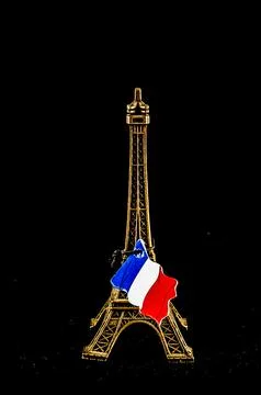 A tall tower with a flag on top of it Stock Photos